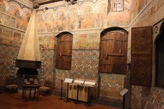 an old room with many wooden doors and windows