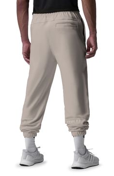 Sporting an oversized fit, these joggers made of stretchy French terry wick away sweat and fight odors with SilverPlus® technology. 26" inseam; 10" leg opening; 12" front rise; 15" back rise (size medium) Elastic waist Side welt pockets; back welt pocket Elastic cuffs Tech-Terry cotton-blend French terry provides enhanced stretch for easy-moving comfort SilverPlus technology wicks away sweat using silver ions embedded in the fiber to prevent the growth of odor-causing bacteria 85% cotton, 13% Si Relaxed Fit Hip Hop Joggers For Loungewear, Hip Hop Style Relaxed Fit Solid Sweatpants, Hip Hop Style Relaxed Fit Joggers For Loungewear, Urban Sweats With Elastic Waistband For Streetwear, Urban Style Sweats For Streetwear With Elastic Waistband, Hip Hop Style Relaxed Fit Joggers With Elastic Waistband, Sporty Cotton Sweatpants For Streetwear, Urban Sweatpants With Relaxed Fit, Urban Style Relaxed Fit Sweats For Sports