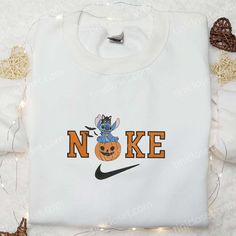 The Nike x Halloween Pumpkin Stitch Embroidered Hoodie is the perfect addition to your spooky wardrobe. With a unique pumpkin Disney Hoodie For Fall, Disney Hoodie With Long Sleeves For Fall, Disney Long Sleeve Hoodie For Fall, White Disney Sweatshirt For Fall, Disney Sweatshirt For Fall Streetwear, Baby Yoda Pumpkin, Yoda Pumpkin, Pumpkin Stitch, Gifts For Halloween