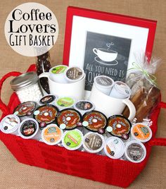 a red basket filled with coffee mugs next to a sign