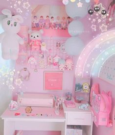 a pink room with lots of toys and decorations on the walls, including a desk