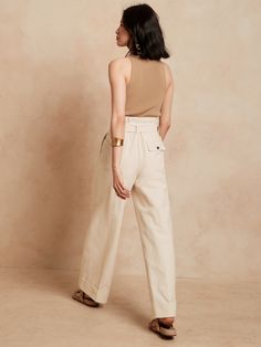 Lustrous and softly structured, this high rise pant is expertly crafted from lightweight faille fabric, cut in an exaggerated wide leg silhouette anchored by a wide, cuffed hem for commanding style.  WIDE-LEG FIT: High waisted.  Straight from waist t Chic Beige Wide-leg Culottes, Chic Wide Leg Cotton Pants For Work, Chic High-waisted Cotton Wide Leg Pants, Chic Cotton High-waisted Wide Leg Pants, Chic Cotton High Waist Wide Leg Pants, Chic Wide Leg Cotton Culottes, Chic High-waist Cotton Culottes, Chic High Waist Cotton Culottes, Elegant High-waisted Cotton Culottes