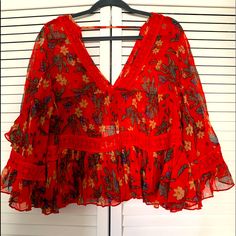 This Is A Light Flowy Material, Definitely Sheer. Love This Top!! Have It In Three Colors Red V-neck Top For Holiday, Red Vacation Top For Fall, Red Floral Print V-neck Top, Red Bohemian Top With Floral Print, Vacation Ruffle Red Blouse, Red V-neck Floral Print Top, Red Bohemian Tops With Floral Print, Bohemian Red Tops With Floral Print, Red Ruffled Blouse For Vacation