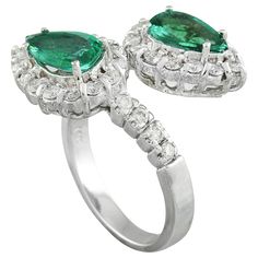 Stamped: 14K Total Ring Weight: 6.3 Grams Emerald Weight 1.50 Carat (8.30x5.60 Millimeters)Diamond Weight: 0.90 carat (F-G Color, VS2-SI1 Clarity )Face Measures: 20.00x20.45 Millimeter SKU: [600552] Luxury Pear-shaped Emerald Ring For Formal Occasions, Formal Pear-shaped Emerald Ring In White Gold, Formal Gia Certified Pear-shaped Rings, Formal Pear-shaped Emerald Ring With Diamond, Formal Cluster Emerald Ring In White Gold, Formal Cluster White Gold Emerald Ring, Formal Marquise Emerald Ring With Brilliant Cut, Gia Certified Pear-shaped Emerald Ring, Marquise Emerald Ring In White Gold For Formal Occasions