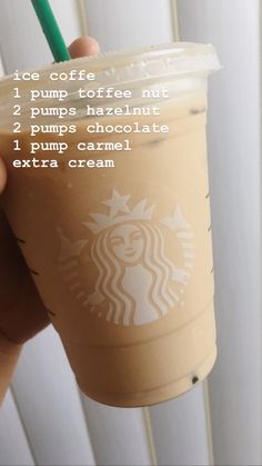 a hand holding up a starbucks drink with instructions on how to make it in the cup