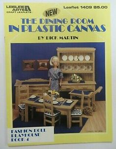 a doll is standing in front of a wicker dining room set with blue walls