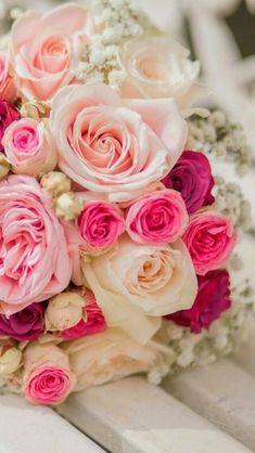 a bridal bouquet with pink and white flowers