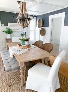 a dining room table with chairs and a bench