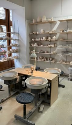 a room filled with lots of different types of pottery