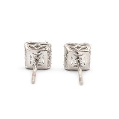 Brand: Tacori  Gender: Ladies  Metal Type: 18K White Gold  Length: 0.50 Inches  Width: 6.50 mm  Weight: 2.10 grams  Ladies filigree-style 18K white gold diamond halo stud earrings with push backs. Engraved with "18K". The "Tacori" trademark (or hallmark) can also be found on the item.  Pre-owned in excellent condition. Might shows minor signs of wear.  V-Prong Set in 18 Karat White Gold with:  Two (2) princess cut natural diamonds:  Measurements: 4.88mm x 5.00mm x ~3.50mm in depth. Weight Range: Luxury Platinum Diamond Earrings Hallmarked, Exquisite Diamond Pierced Earrings For Formal Occasions, Exquisite Pierced Diamond Earrings For Formal Occasions, Classic Diamond White Pierced Earrings, Formal Diamond Earrings, Pierced, Formal Pierced Diamond Earrings, Timeless Hallmarked Diamond Earrings For Formal Occasions, Classic Diamond Cut Earrings For Evening, Fine Jewelry Bridal Earrings For Formal Occasions