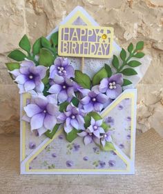 a birthday card with purple flowers on it