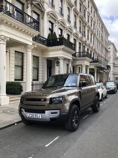 a line of cars parked on the side of a street