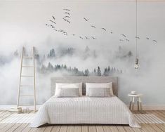 a bedroom with a large mural on the wall