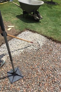 a person is shoveling gravel in the yard