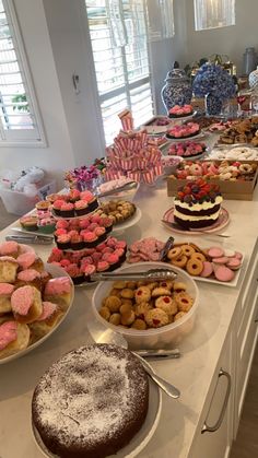 a table filled with lots of desserts and pastries