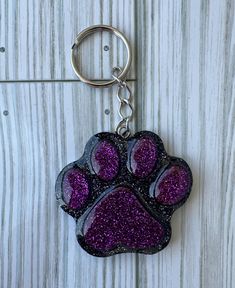 This cute purple on gold paw print could be for your favorite colors, or black and gold shaped heart , football team or you're a dog lover ... these keychains are made out of resin. They are hung on a chain with an eternal ring. Resin Keychain Football, Paw Print Keychain, Purple Resin, Summer Rose, Football Teams, Long Periods, Purple Glitter, School Colors, Badge Reel