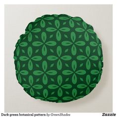 a green circular pillow with leaves on it's sides and the words dark green botanical pattern by greensdales