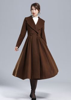 "Bold + bright in this princess coat from Xiaolizi. The long wool coat made in a fit and flare shape, open-front construction. The elegant coat topped with a lapel. The winter jacket features long sleeves + seam pockets at the hips. The pleated coat finished with princess seams at the back. The winter outwear can also be a good gift for her. DETAIL * More color optional https://etsy.me/3C1mvuW * 50% wool, 50% fiber, nylon, polyester * Polyester lining * Two side Seam pockets * Lapel collar * Lon 50s Coat, Brown Princess, Pleated Coat, Women Winter Coat, Brown Wool Coat, Princess Coat, Coat Autumn, Elegant Coats, Winter Outwear