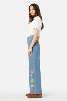 Denim embroidered jean featuring fresh cottage style floral celebrating spring. This cute jean has a high waisted fit, straight leg and slight stretch- floral embroidery along side of leg - high waisted rise - handy belt loops & pockets - straight cut full length leg - made of a cotton elastane blend denim - available in mid denim Product Code: PGFY055 High Rise Embroidered Denim Jeans, Embroidered High-waist Denim Jeans, High Rise Floral Embroidered Jeans, Embroidered Wide-leg Fitted Jeans, Embroidered Mid-rise Denim Flare Jeans, Cute Jeans, Embroidered Jeans, Colorblock Dress, Knitwear Tops