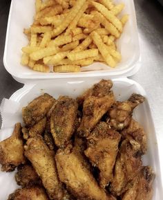 two plastic containers filled with chicken wings and fries