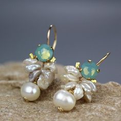 Blue Swarovski Bee Earrings, Pearl Earrings, Bridal Earrings, June Birthstone, Pearl Bridal Earrings, Birthstone Jewelry, Bridesmaid GiftThese soft and feminine bee earrings are made of beautiful genuine faceted swarovski crystal set on a copper base. The bee wings are made of natural wild pearls. Delicate pearl gemstone dangles down and gives it an elegant look. A unique handcrafted eye catching jewelry piece!The hook is made of gold filled. The earring's hook can be made with sterling silver o Natural Stones Drop Earrings For Wedding, Elegant Natural Stone Pearl Earrings For Anniversary, White Pearl Earrings With Natural Stones For Wedding, White Natural Stone Pearl Earrings For Wedding, Fine Jewelry Crystal Earrings For Wedding, Delicate Gemstone Earrings For Wedding, White Natural Stones Earrings For Wedding, White Natural Stone Wedding Earrings, Exquisite Pearl Earrings With Gemstone For Wedding