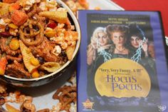 a bowl filled with cereal next to a book