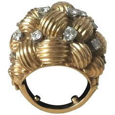 A fantastic Midcentury gold and diamond cocktail ring. Fabulous knotted design which is highlighted with diamonds across the dome. This piece has been styled in classic Hollywood glamour. Quality and styling of this ring in the style of the great Van Cleff Jewlery. Piece has been custom fitted with a spring and locked shank. Ring is first quality. Heavy in weight. Diamonds are full cut and approx 1.00 +_ in total. Approx size 7 Simply an exquisite ring. Classic Hollywood Glamour, Rutilated Quartz Ring, Diamond Cocktail Ring, Gold Cocktail Ring, Gold Cocktail, Diamond Cocktail Rings, Modern Ring, Diamonds And Gold, Van Cleef Arpels