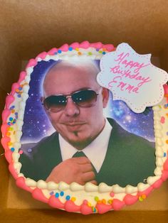 a birthday cake with a photo of a man wearing sunglasses