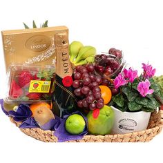 a basket filled with lots of fruit and vegetables