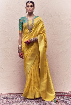 Upgrade your saree collection with our Silk Saree. Made from pure crepe dola silk, it features heavy viewing work and tussles on the pallu. The perfect blend of elegance and luxury, this saree will make you stand out at any event. Elevate your style game with this exquisite piece. Stitching Option - We will email you the measurement guide to confirm your size. FABRIC: Pure Crepe Dola Silk With Heavy Viewing Work And Tussles On Pallu SAREE FABRIC SIZE: 5.5 Meters BLOUSE FABRIC SIZE: 0.80 Meters S Dola Silk Saree, Yellow Saree, Art Silk Sarees, Fancy Blouses, Zari Work, Traditional Sarees, Yellow Fabric, Banarasi Sarees, Blouse Length