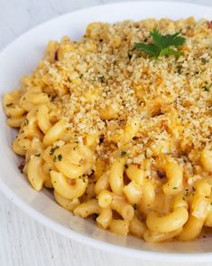 a white bowl filled with macaroni and cheese