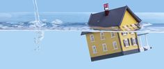 a house floating in the water next to an ice floet that has been frozen