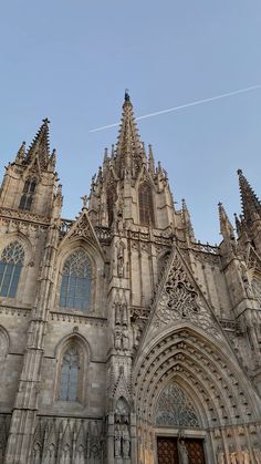 an old cathedral with two clocks on the front