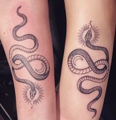 two people with tattoos on their legs and one has a snake tattooed on the leg