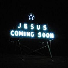 a neon sign that says jesus is coming soon in the dark with stars on it