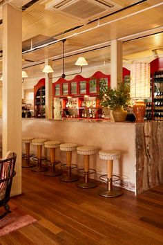 a bar with several stools in front of it