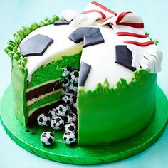 a soccer themed cake is on a green plate