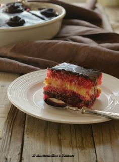 a piece of cake on a plate with a spoon