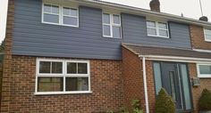 a blue house with white trim and windows