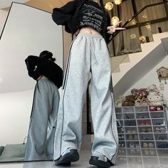 Product information: Color: black. gray Style: Casual/Street/Punk/Vintage/Hip Pop/Preppy Pants length: trousers Size: S.M.L.XL Applicable Gender: Female Pants type: Wide LegDescription:Step up your street-style game with our Contrast Color Piping Detail Sweatpants. These pants are a perfect blend of casual. street. punk. vintage. hip-hop. and preppy elements. making them a versatile choice for the fashion-forward individual.Available in classic black and stylish gray. these sweatpants allow you to express your unique style while keeping comfort a top priority.Crafted for a loose fit. these wide-leg trousers are designed to provide comfort and style. whether you're running errands or meeting up with friends.The contrast color piping detail adds a unique touch. giving the pants a fashionable Gray High Waist Baggy Sweatpants, Gray Trendy Straight Sweatpants, Gray Straight Sweatpants Trendy Style, Trendy Gray Straight Sweatpants, Trendy Gray Wide Leg Pants, Trendy Gray Wide-leg Pants, Stretch Gray Pants For Streetwear, Gray Wide Leg Bottoms For Winter, Gray High-waisted Pants For Winter