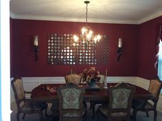 a dining room table with chairs and a chandelier