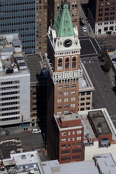 an aerial view of buildings and a clock tower