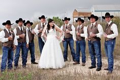 a group of men and women dressed in cowboy attire