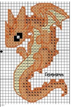 a cross stitch pattern with an orange dragon on it