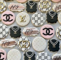 decorated cookies are arranged in the shape of chanel