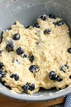 dough with blueberries in a mixing bowl