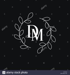 the letter m in a circle made of leaves and branches on a black background - stock image