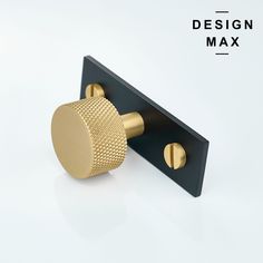 a black and gold door handle on a white background with the words design max above it