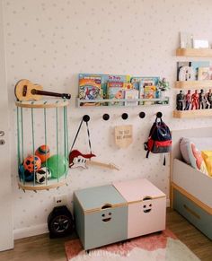 a child's bedroom with toys, bookshelves and other items on the wall