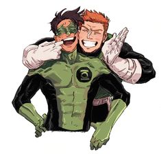 two men in green and black costumes hugging each other